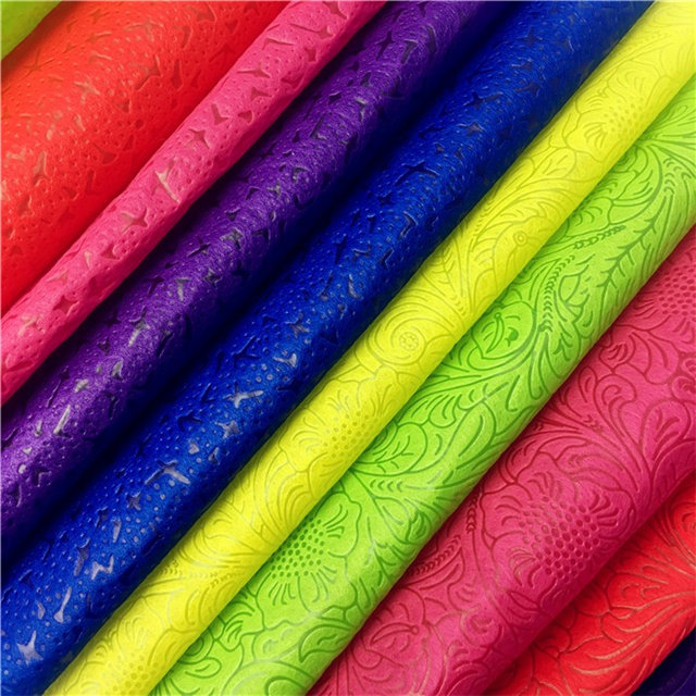 China top quality colorful emboss nonwoven fabric manufacturer